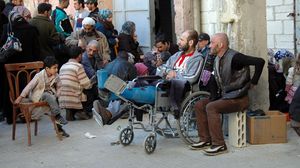سوريون كانوا وسط الحصار في حمص - ا ف ب
