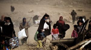 8 آلاف شخص نزحوا من غرب الموصل أغلبهم يعانون من الجفاف- أ ف ب