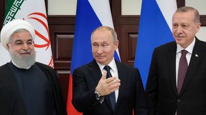 قادة تركيا وروسيا وإيران عقدوا قمة في شباط الماضي بسوتشي لبحث الأزمة السورية- جيتي 
