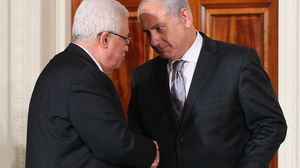 رئيس الوزراء الاسرائيلي نتنياهو ورئيس السلطة الفلسطينية محود عباس - ا ف ب