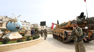 القوات التركية والجيش الحر بدءا بتمشيط شوارع المدينة- جيتي