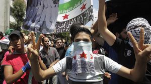 في منتصف آذار/ مارس 2011، كانت بداية الثورة من درعا في الجنوب السوري- جيتي