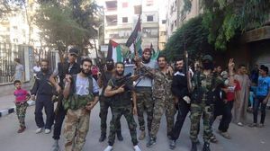 مقاتلو أكناف بيت المقدس يحتفلون بعد طردهم مقاتلي تنظيم الدولة - تويتر