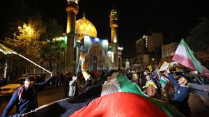 خرج آلاف الإيرانيين في الشوارع للاحتفال بالضربة- جيتي