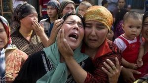 مسلمات من الإيغور يبكين الضحايا - أرشيفية