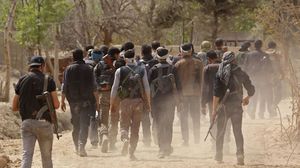 مقاتلون خرجوا من جنوب دمشق بموجب اتفاق مع النظام السوري إلى شمال البلاد- جيتي