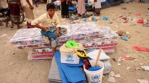 طفل يتلقى مساعدات إغاثية من الأمم المتحدة في اليمن- جيتي