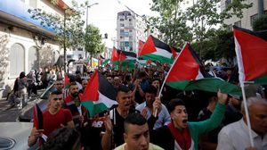 جانب من مسيرة في رام الله رفعت الأعلام الفلسطينية- فيسبوك