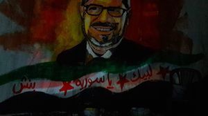 جدارية رسمها نشطاء سوريون في مدينة بنش بإدلب