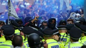 أصيب  14 ضابطا خلال اشتباكات مع مجموعة من المحتجين وسط لندن- جيتي