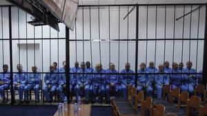 عدد من مسؤولي نظام القذافي أثناء المحاكمة - رويترز
