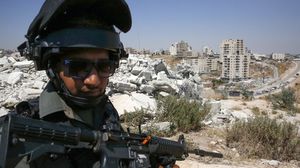 جندي للاحتلال يقف على ركام منازل المقدسيين بعد هدمها بصور باهر- جيتي