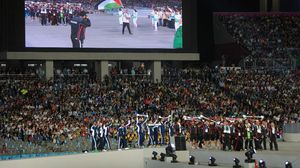 الوفد الفلسطيني المشارك بالألعاب الآسيوية خلال مراسم افتتاح الدورة - أ ف ب