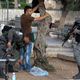 القوات من جيش الاحتلال الإسرائليلي تفتش فلسطينينا ـ أ ف ب