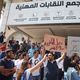 شاب يرفع لافتة تطالب بالباقورة بفعالية في عمّان العام الماضي- عربي21