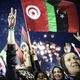 الليبيون يحتفلون عقب إعلان تحرير البلاد في ميدان الشهداء في طرابلس 2011 - جيتي