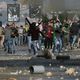 شبان فلسطينيون يرشقون قوات الاحتلال بالحجارة- جيتي
