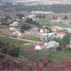 منظر عام للقرية تظهر مستوطنة ميرون الدينية اليهودية المقامة على القرية وشارع صفد 2003