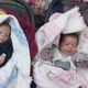 التوأمان الرضيعان يحملان أسوارة كتب عليها اسم الأم رانيا ضيف الله- إكس