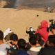 شبان يرشقون الاحتلال بالحجارة في مسيرة العودة- جيتي