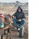 مصطفى أبو السعود- فلسطيني رفح غزة يتفقد بيته المهد على عربة حمار- عربي21