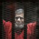 مرسي مرتديا الزي الأحمر مصر - الأناضول