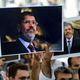 صور الرئيس مرسي في مراسم تشييع رمزية في إسطنبول - جيتي