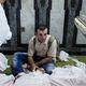 شقيق أحد ضحايا مجزرة رابعة يجلس أمام جثته- جيتي