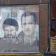 ملصق يحمل صورة بشار الأسد وحسن نصر الله في دمشق في أيلول 2017 - أ ف ب